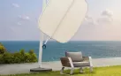Biały designerski parasol z podstawą granitową okrągłą tekno higold
